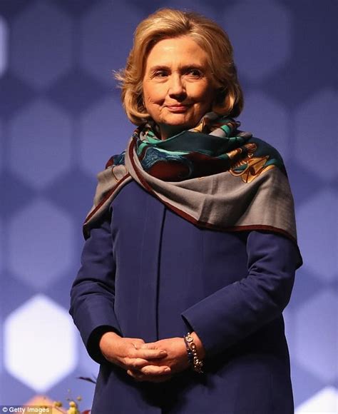 Hillary Clinton wears a scarf after suggestions she has a back 